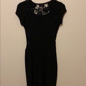 Black fitted lace dress.